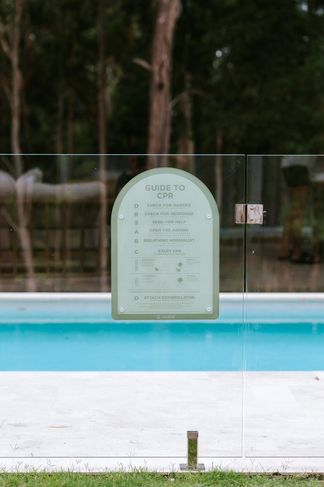 CPR Pool Sign The Halo - Green on fence